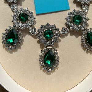 Anna Dello Russo at H&M emerald green necklace